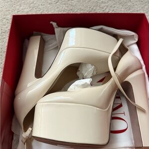Valentino Garavani bone color tango shoes.